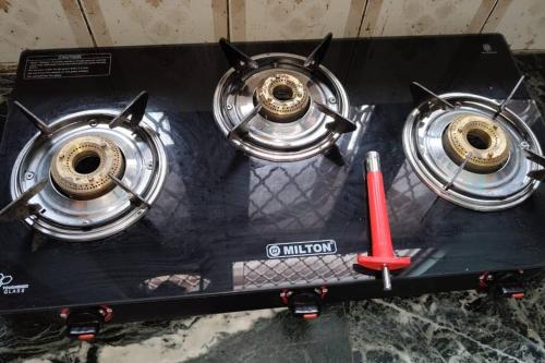 a set of three drums on a black table at Luxurious 3 BHK Flat in Ghaziabad in Ghaziabad
