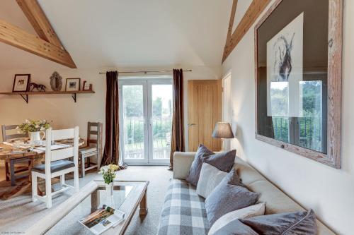 a living room with a couch and a table at Sansoms Loft in Woodstock