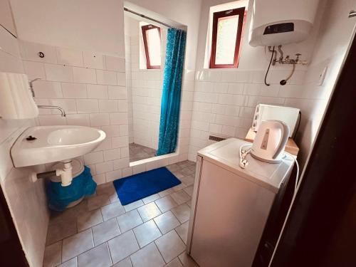 a bathroom with a sink and a toilet and a shower at LEO - PENZION in Jevišovice
