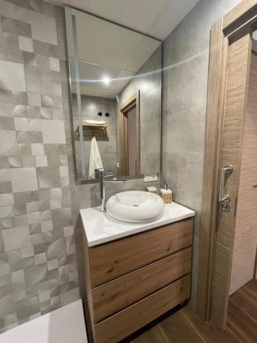 a bathroom with a sink and a mirror at Luxury Views Marbella in Marbella