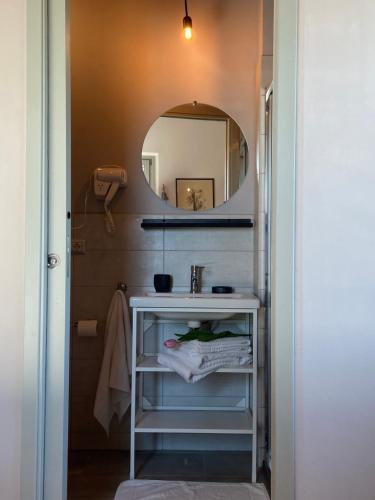 a bathroom with a sink and a mirror at Agriturismo Riva Mondina in Casa Rougna