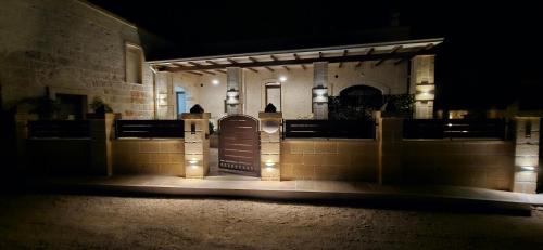 a front door of a building at night with lights at Le Stelle di Nonna Anna in Monopoli