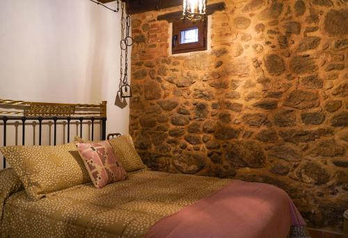 Postel nebo postele na pokoji v ubytování La casa de la tía Antonia