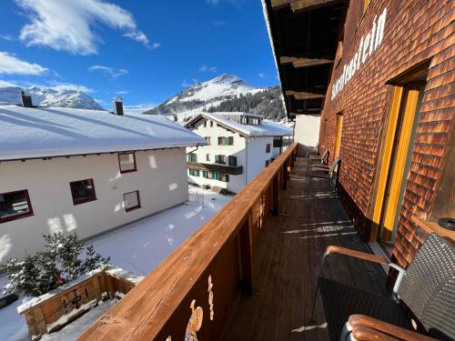 a balcony with a view of the mountains at Haus Schrofenstein in Lech am Arlberg