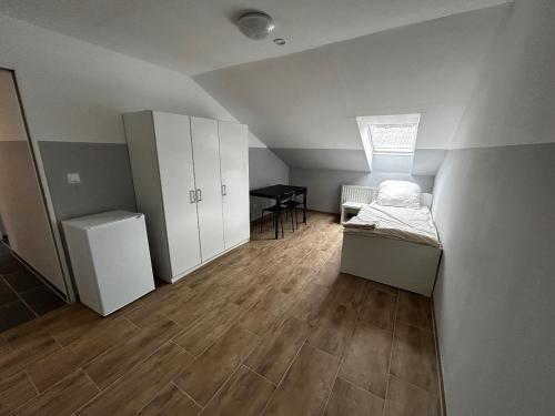 Ένα ή περισσότερα κρεβάτια σε δωμάτιο στο Boardinghouse Wendelstein