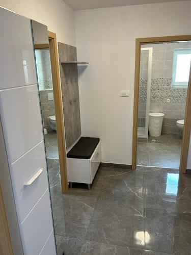 a bathroom with a sink and a toilet and a mirror at Sweet Lapat by EL-PI TOURS in Porat