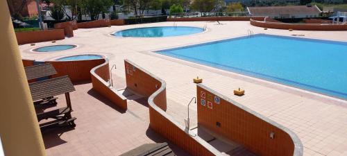 a large swimming pool with two large pools at Casa das Rosas in Crato