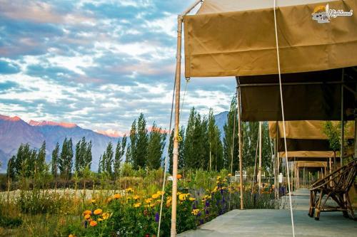 a tent with a view of the mountains at Highland Desert Camp in Leh