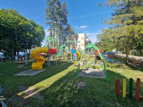 a park with a playground with a slide at Ośrodek Promenada- Horyzont in Jastrzębia Góra