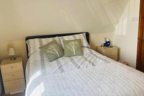 Ένα ή περισσότερα κρεβάτια σε δωμάτιο στο River Lark Lodge