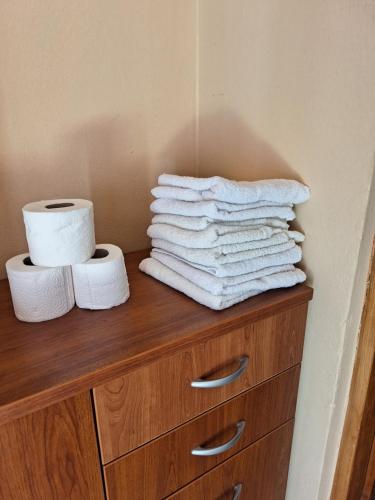 a pile of towels on top of a wooden dresser at Mara in Zadar