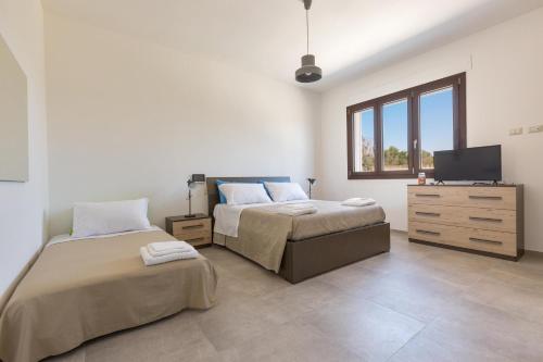 Ένα ή περισσότερα κρεβάτια σε δωμάτιο στο Villa Sirio by Perle di Puglia