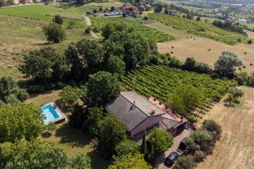 an aerial view of a farm house with a swimming pool at Exclusive Duplex Villa con piscina e vista in Strognano