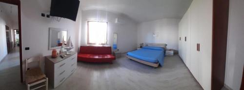 Säng eller sängar i ett rum på Casa con giardino 2 camere