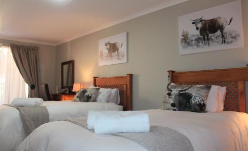 Katil atau katil-katil dalam bilik di Hoopstad Guesthouse