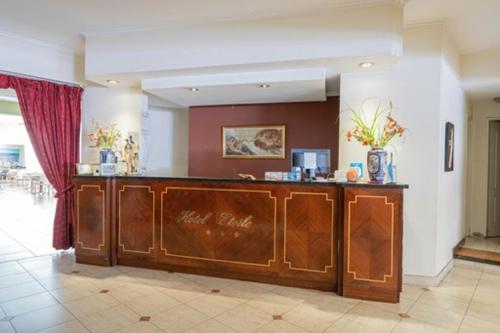 a lobby with a wooden counter in a room at Etoile in Mar del Plata