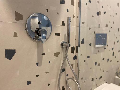a bathroom with a shower with a mirror on the wall at Dimora Zonno in Bari