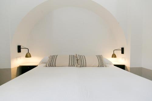 En eller flere senge i et værelse på CORRALA LA ALMOHADA