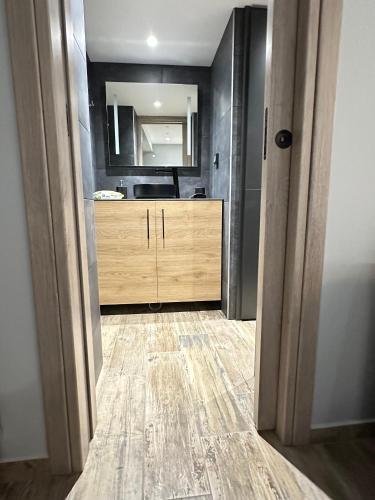 a bathroom with a sink and a vanity with a mirror at Magic View Luxury Villa 4u - Spiro Spero in Kineta