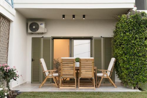 a table and chairs sitting on a patio at Villa Elxis in Limenas