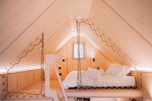 a bedroom with a swing in the attic at Mertrick in Forest Mill