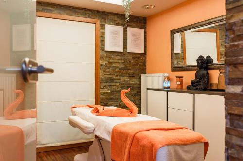 a hospital room with two beds and a mirror at Hotel Vista in Brno