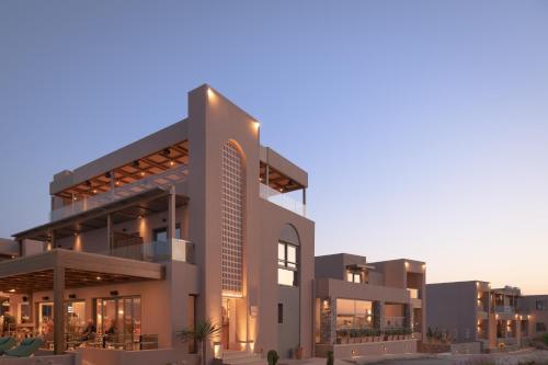a rendering of a building at dusk at Paralos Venus Suites Adults Only in Hersonissos