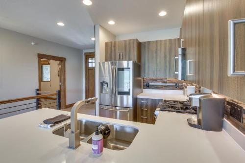 a kitchen with two sinks and a refrigerator at Powder Mountain Home with Private Hot Tub and Views! in Eden