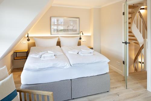 Postel nebo postele na pokoji v ubytování Strand 48