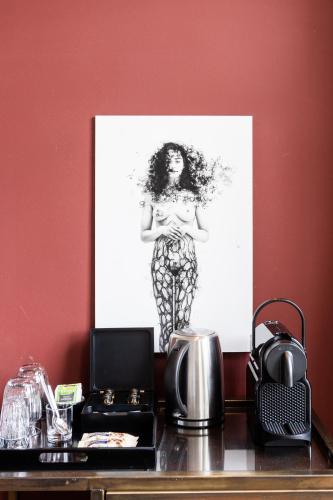a black and white picture of a woman on a table at Weber Hotel 397 in Amsterdam
