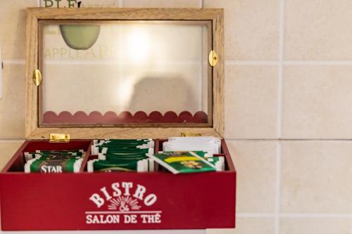 a red box in front of a mirror at La Rua in Ascoli Piceno