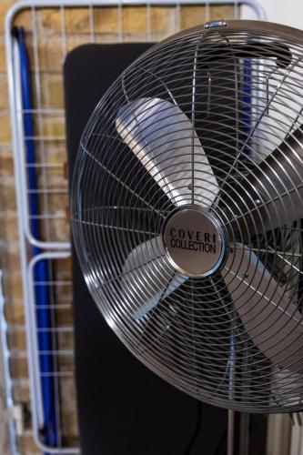 a metal fan with a sign that reads sovereign collection at La Rua in Ascoli Piceno