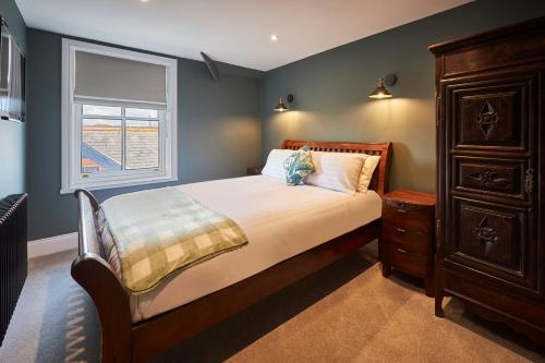 a bedroom with a large bed and a window at Host & Stay - 1895 at Whitby in Whitby