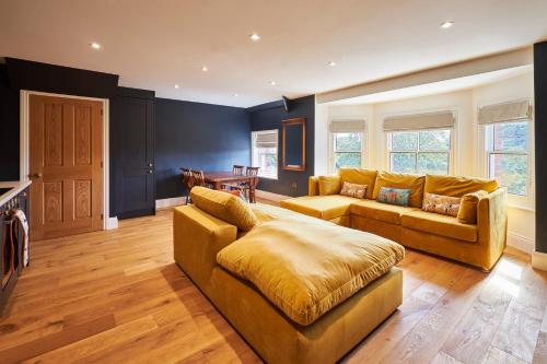 a living room with a couch and a table at Host & Stay - 1895 at Whitby in Whitby