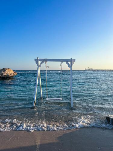 a swing in the water on the beach at Radisson Blu Resort El Quseir in Quseir