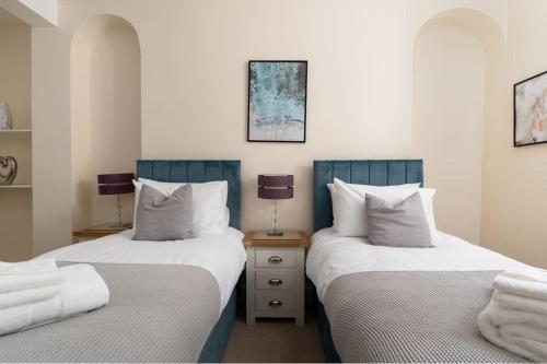 two beds sitting next to each other in a room at Room 1, Hotel style twin bedroom in Marazion in Marazion