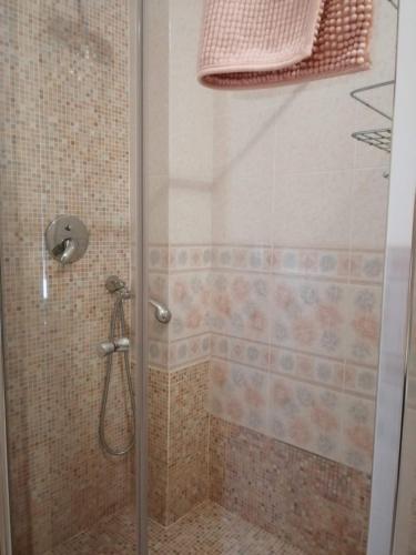 a shower with a glass door in a bathroom at Sirolo - Pesciolino Azzurro in Sirolo