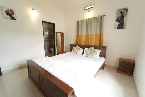 Ένα ή περισσότερα κρεβάτια σε δωμάτιο στο Coorg Farm Stay