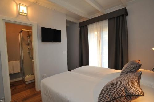 a hotel room with a bed and a window at Baita Fanti Ski & Bike in Bormio