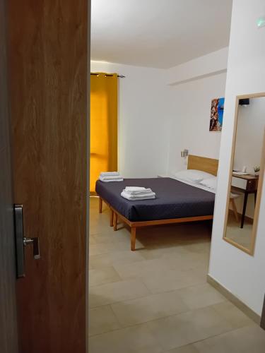 Ένα ή περισσότερα κρεβάτια σε δωμάτιο στο Eliseo's rooms