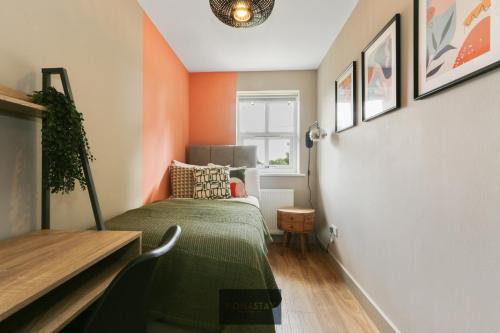 a small room with a bed and a table at Lynwood House City Center ideal for long stays in Sheffield