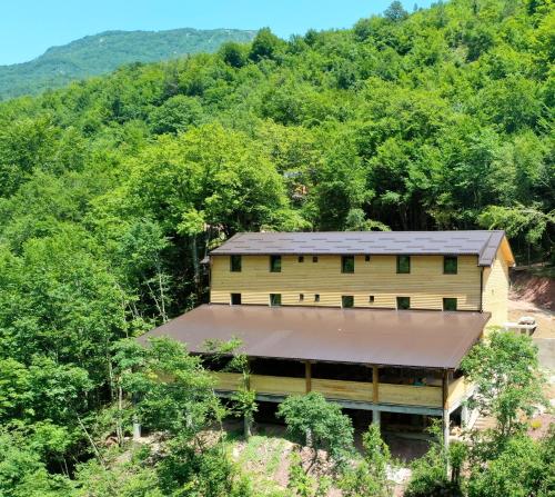 a house in the middle of a forest at Vucja Gora in Foča