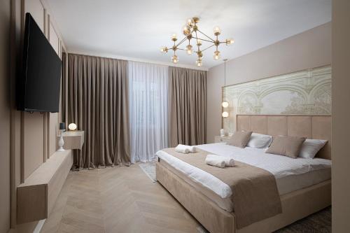 a bedroom with a large bed and a television at Via Flavia Luxury Accommodation with FREE private parking in Pula