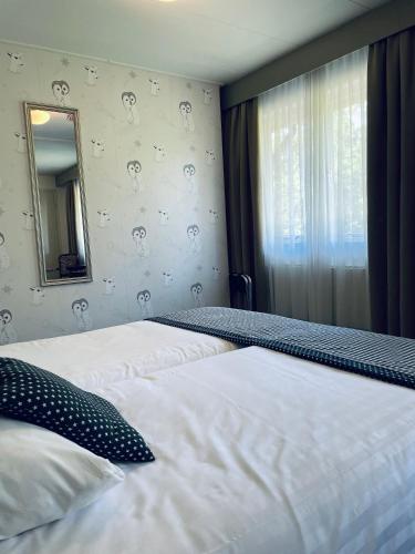 Letto o letti in una camera di Landgoedhotel Villa Vennendal