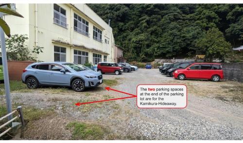 a group of cars parked next to a building at 神倉書斎 [Kamikura-Hideaway] in Shingu