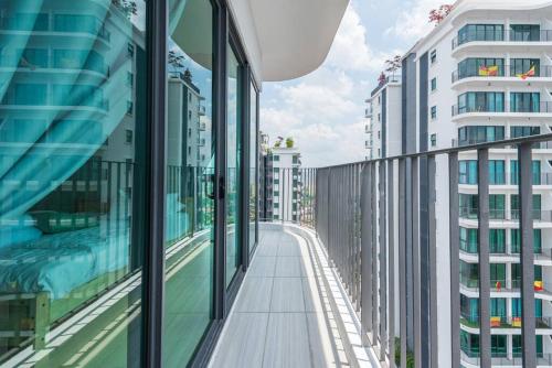 a balcony of a building with glass windows at Skyring Homestay 5min to KLCC in Kuala Lumpur