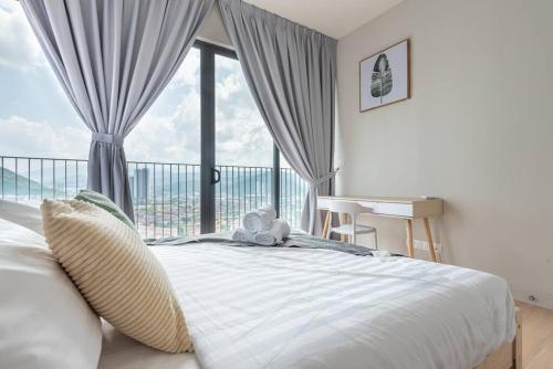 a bedroom with a bed with a window and a desk at Skyring Homestay 5min to KLCC in Kuala Lumpur