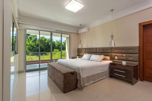 Giường trong phòng chung tại Casa Fênix