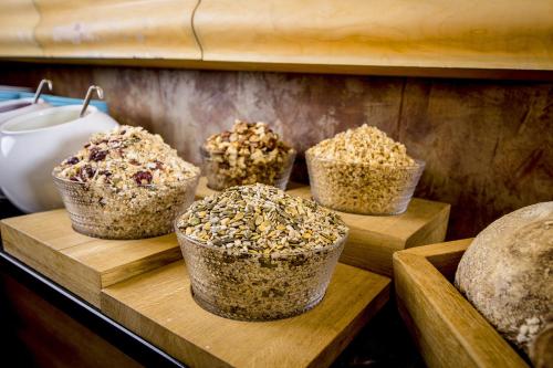 a group of muffins sitting on a wooden shelf at Hotel Klaus K in Helsinki