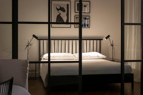 Postel nebo postele na pokoji v ubytování Everyday Apartments Corte Petroni